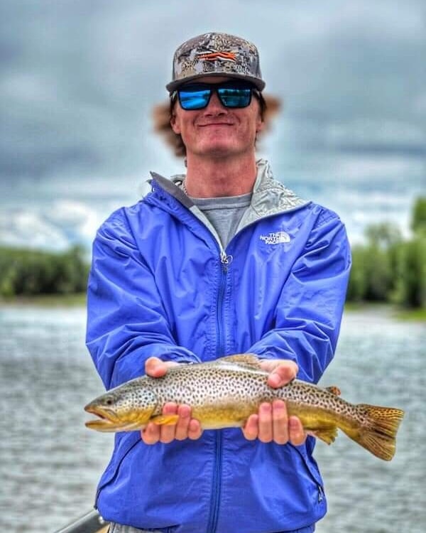 Angler with Brown Trout on the South Fork of the Snake River.
