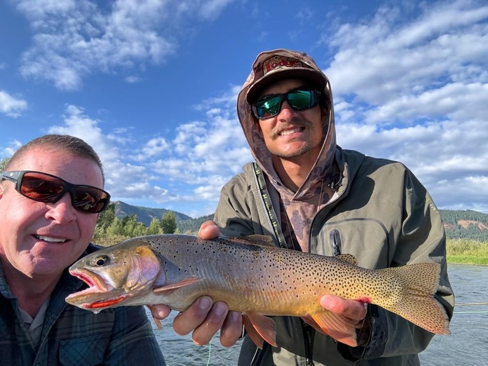 Guide holds Cutthroat trout on South Fork of the Snake River