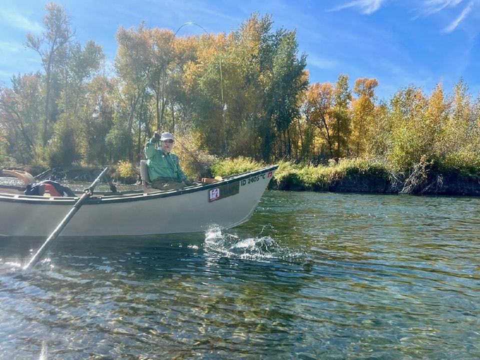 Drift Boat angler with a fish on. South Fork of the Snake River