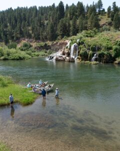 Anglers in front of a waterfall in Swan Valley Idaho.