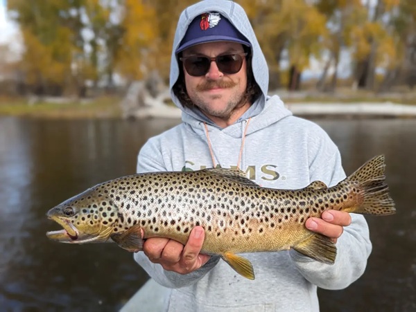 Fishing guide Christian Phillips with a Brown Trout