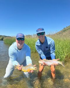 A double! Two anglers with fish on the South Fork of the Snake River.